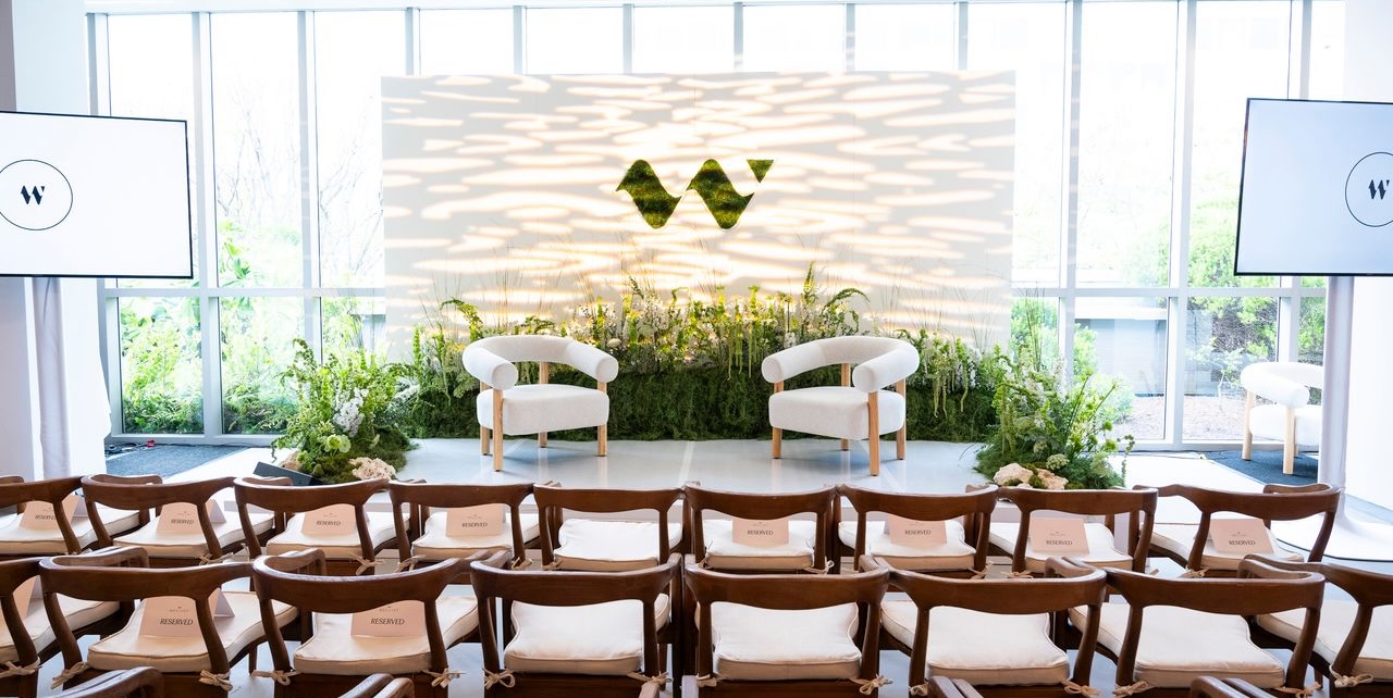 Wellist stage set with two chairs and seated audience